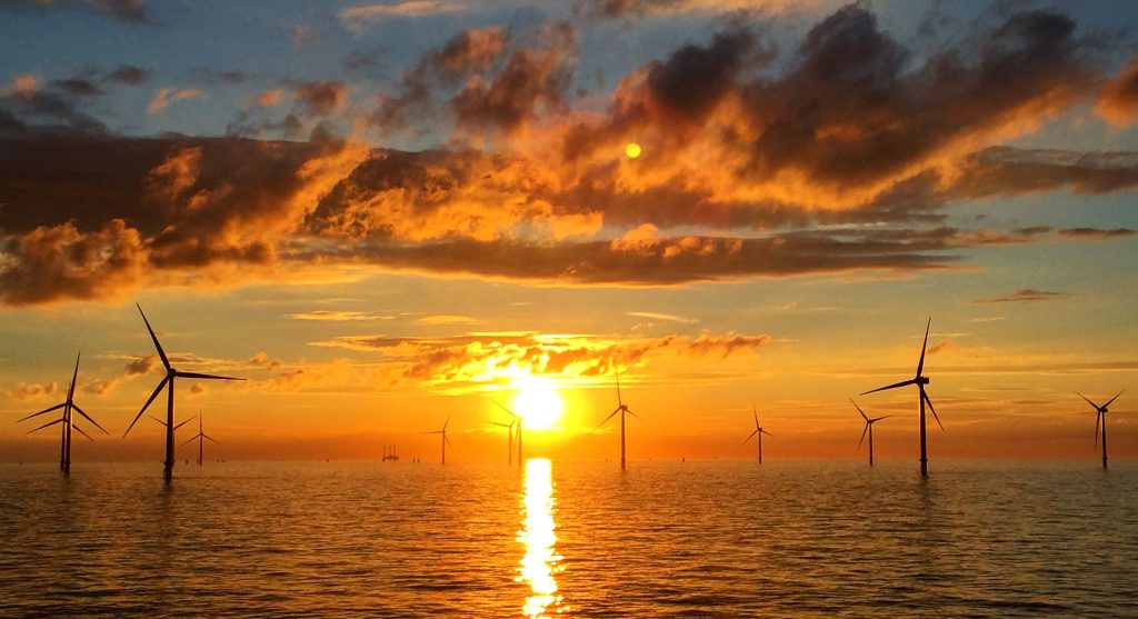 image of wind turbines at sun rise
