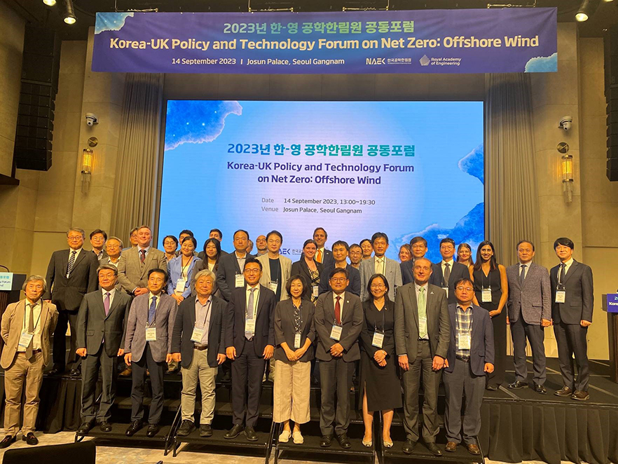 Prof James Gilbert stands with delegates at the meeting in Korea