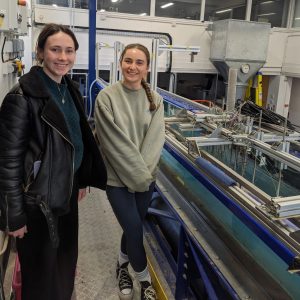 Maisy and Jordan in the Cohen lab by the experimental flume